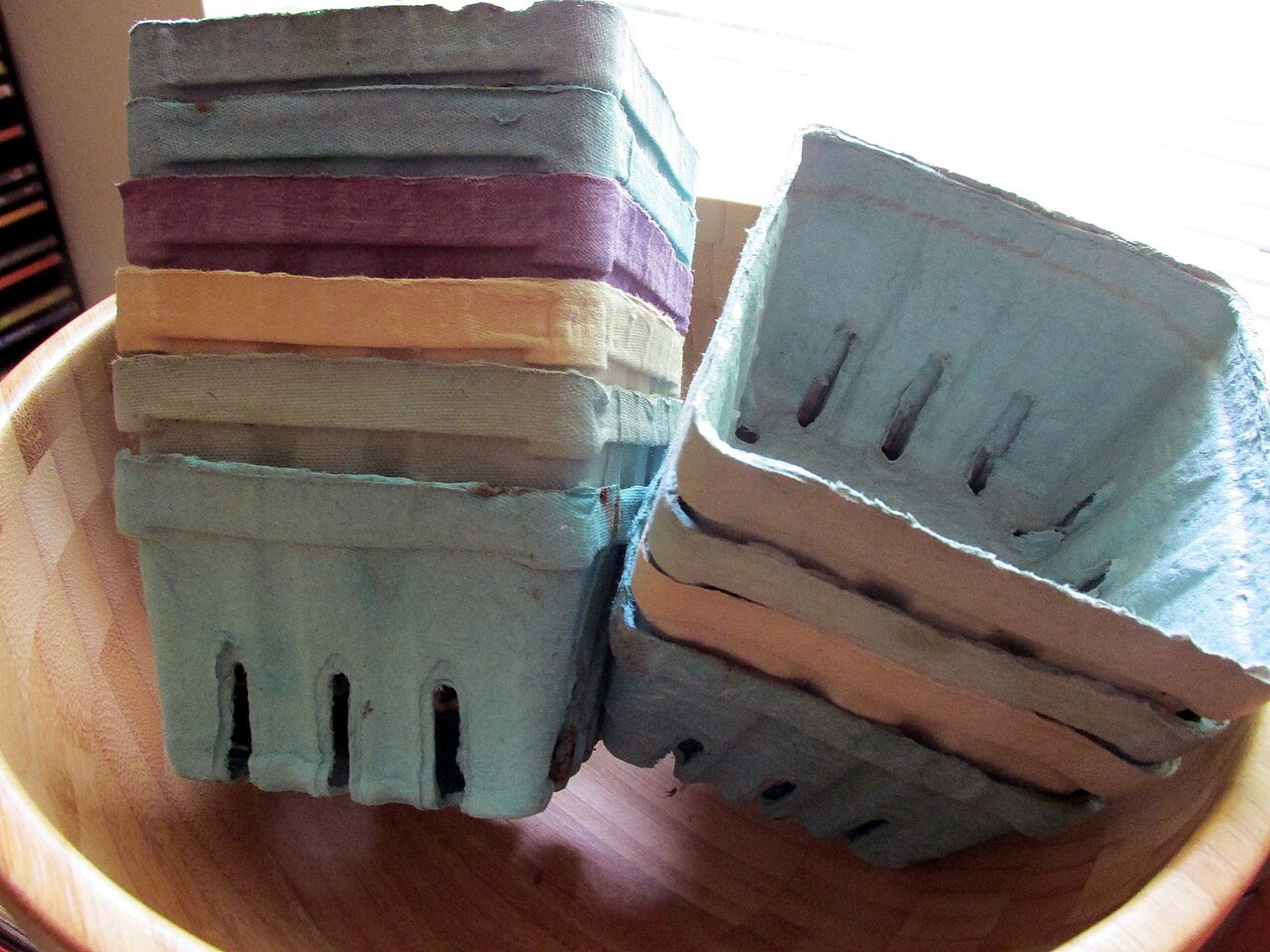 Generic molded-pulp produce baskets, not products from the acquired company