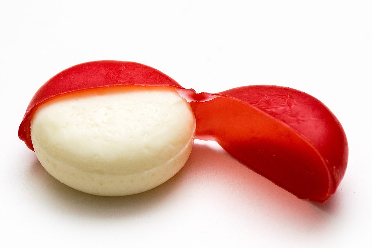 Red wax around a cheese, not the new outer wrapper
