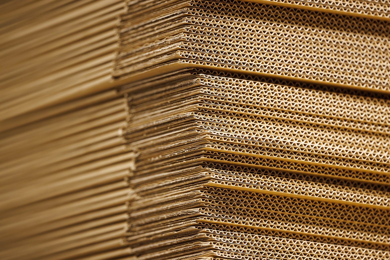 Close-up of flattened stacked corrugated box material, not IKEA's distribution centre